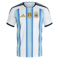 Argentina Home Football Shirt 2026 Adidas white showing sky blue gradient vertical stripe Albiceleste classic AFA Argentina Football Association crest 3 gold stars FIFA World Cup 2022 winner gold trophy badge gold Adidas 3-bar logo navy V-neck collar light blue inner accent navy Adidas 3-stripe shoulders navy light blue cuff trim front view on white background