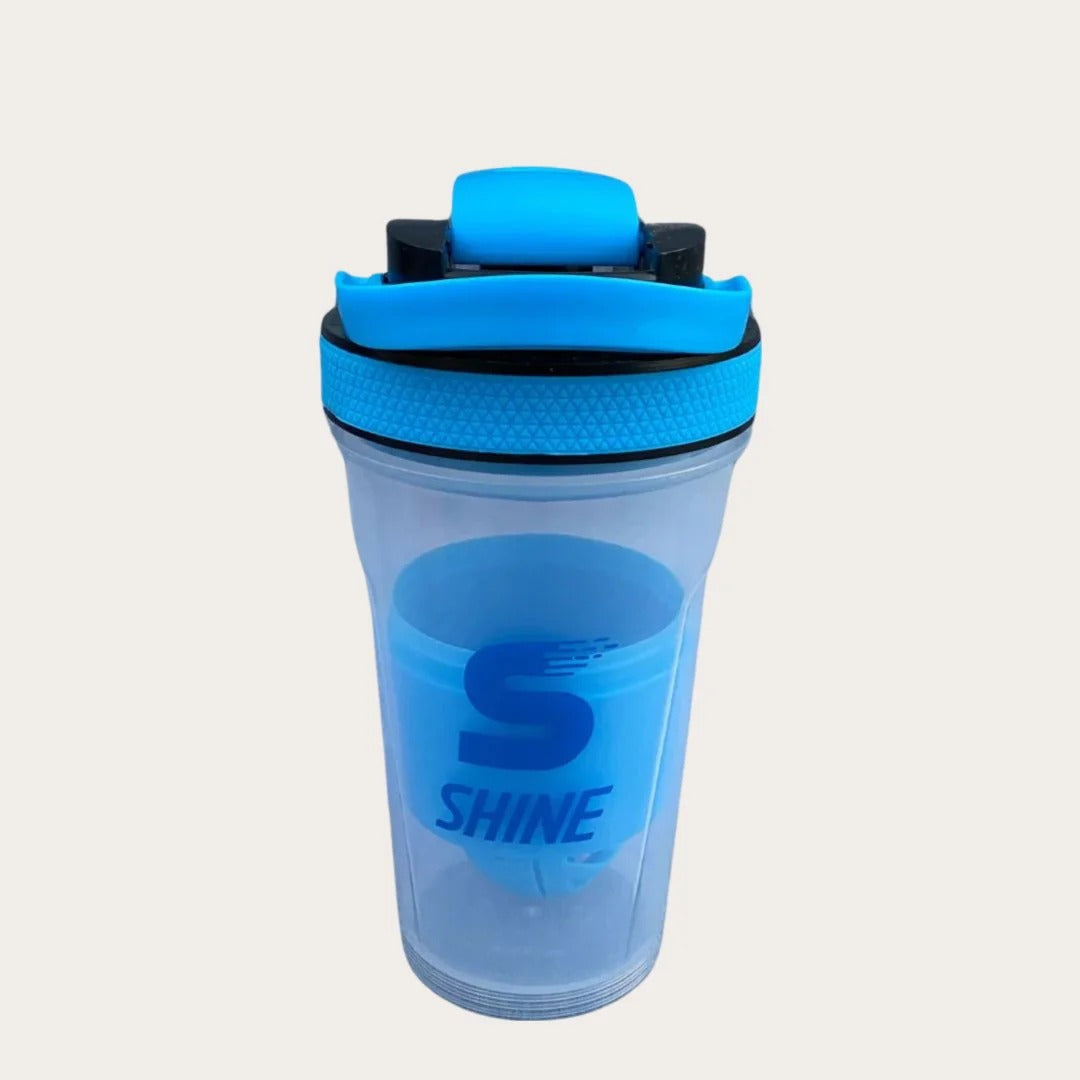 SHINE Protein Shaker Bottle blue transparent body with blue flip-lock lid showing SHINE S logo branding - front view single bottle