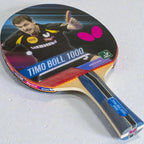 Butterfly Timo Boll 1000 Table Tennis Racket front view showing Timo Boll photo label red rubber face blue striped handle and pink Butterfly logo - product front view