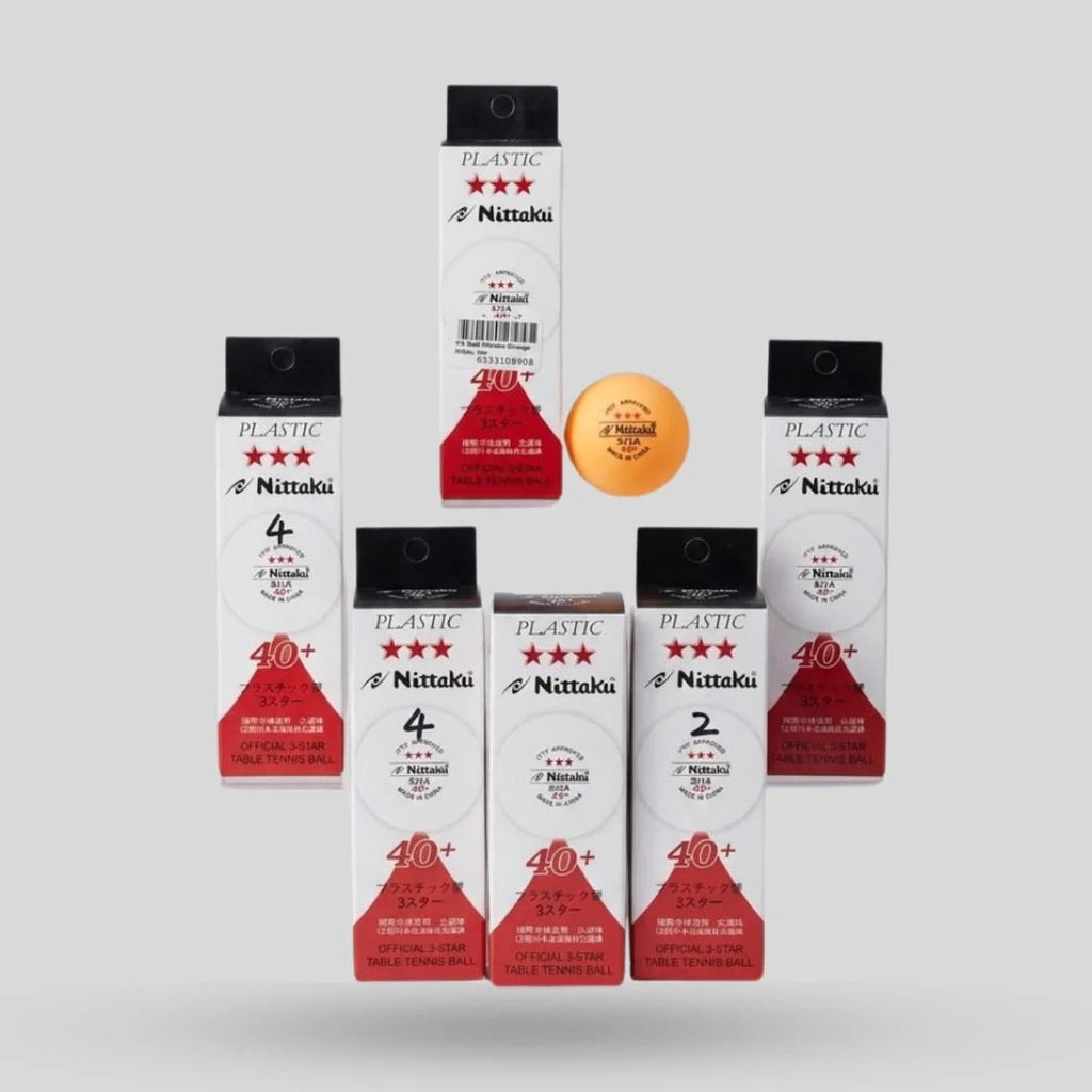 Nittaku 3 Star Plastic 40+ Table Tennis Balls multiple white red tube packs displayed with one orange Nittaku ball - multi-pack display view