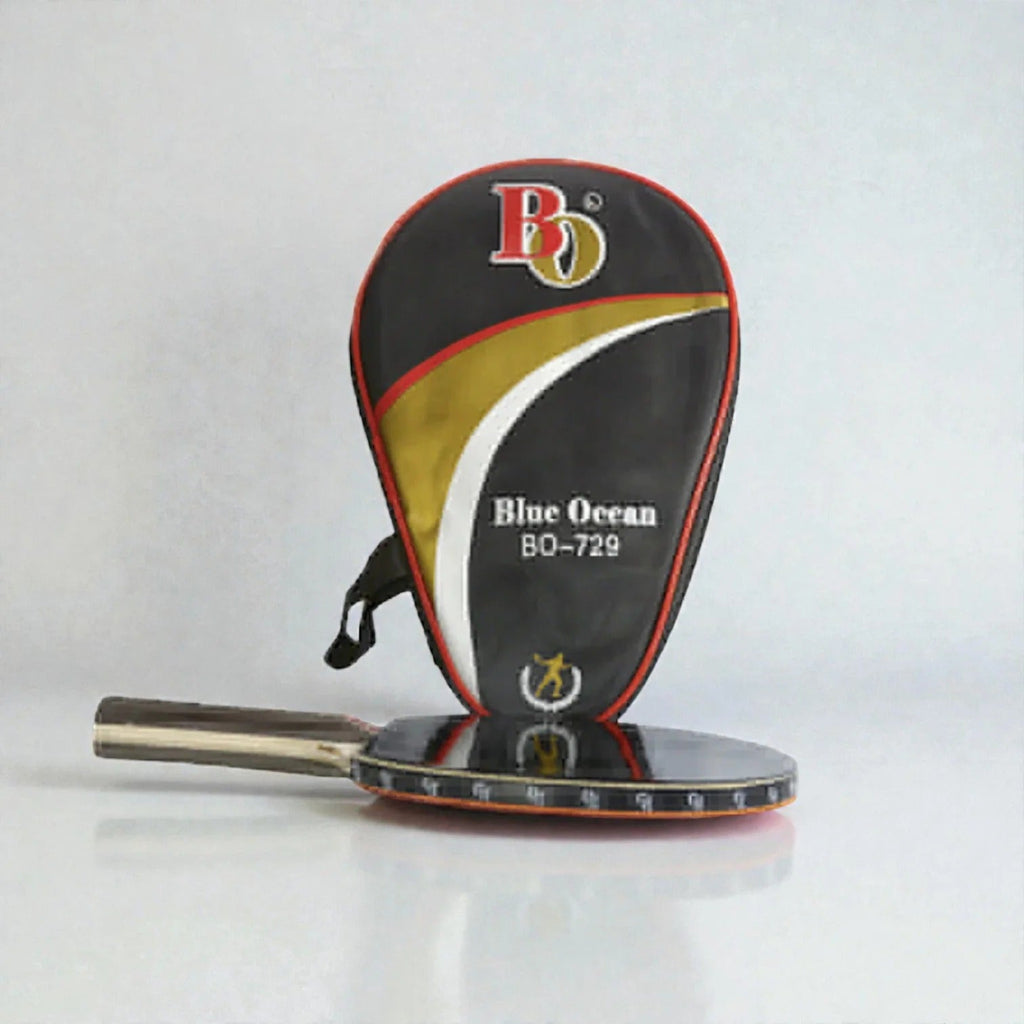 Blue Ocean BO-729 Table Tennis Racket lying flat beside black gold red white BO-729 racket shaped carry case on grey background - flat lay view