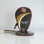 Blue Ocean BO-729 Table Tennis Racket lying flat beside black gold red white BO-729 racket shaped carry case on grey background - flat lay view