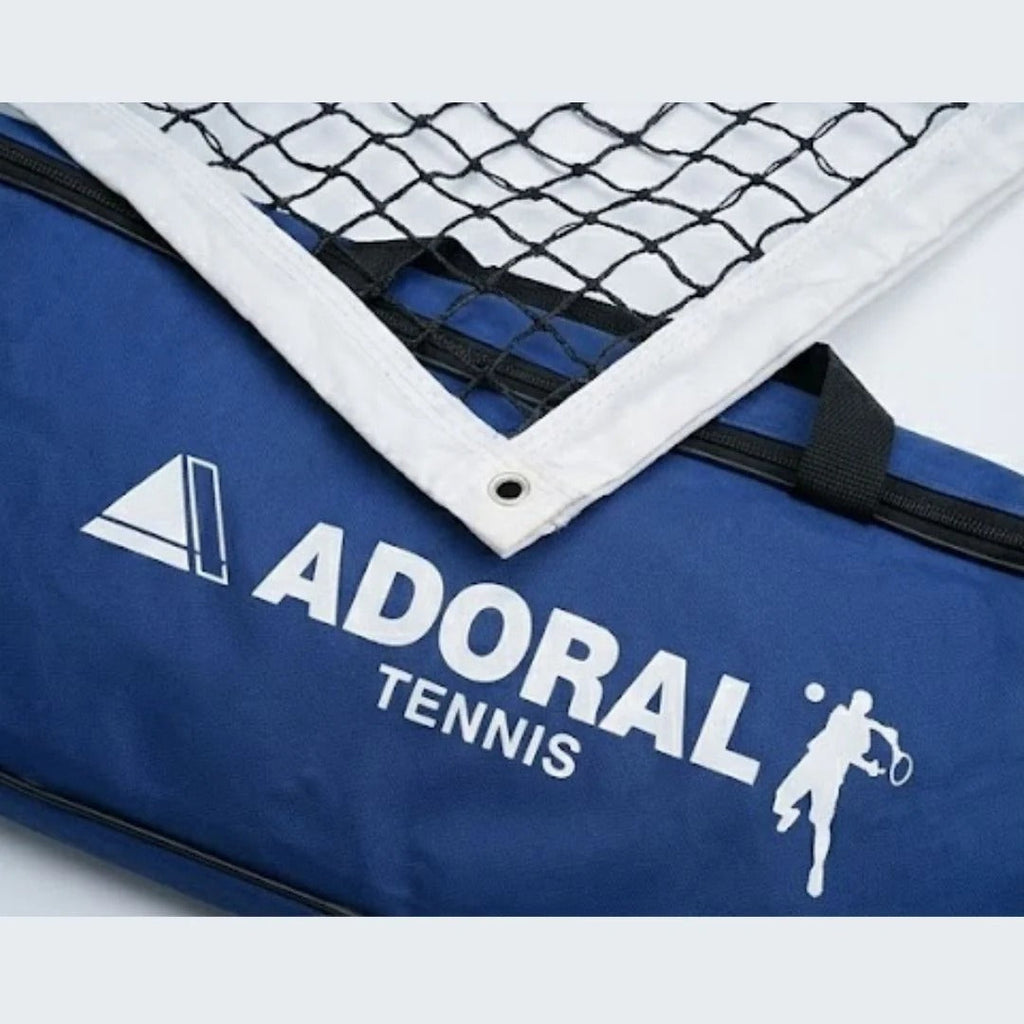 Adoral lawn tennis net close-up showing black nylon mesh and white tape border with Adoral Tennis carry bag