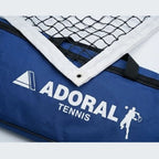 Adoral lawn tennis net close-up showing black nylon mesh and white tape border with Adoral Tennis carry bag