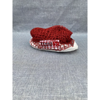 Heat X badminton net iron wire H-16 red nylon mesh folded showing Heat X Badminton branding on white tape band