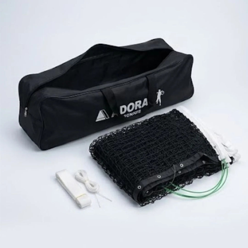Adoral lawn tennis net double complete set showing folded black net, center strap and open black Adoral Tennis carry bag - side view