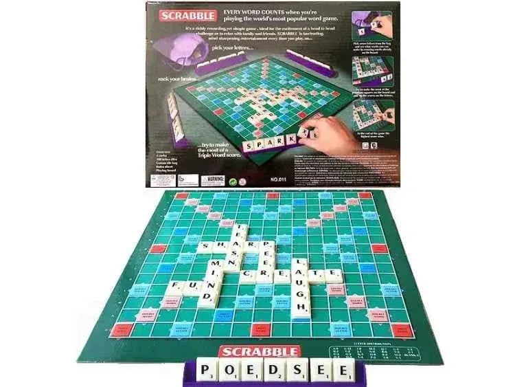 Scrabble board game in play showing words formed with letter tiles