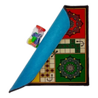 Premium velvet Ludo mat rolled showing blue non-slip backing with colored tokens jar