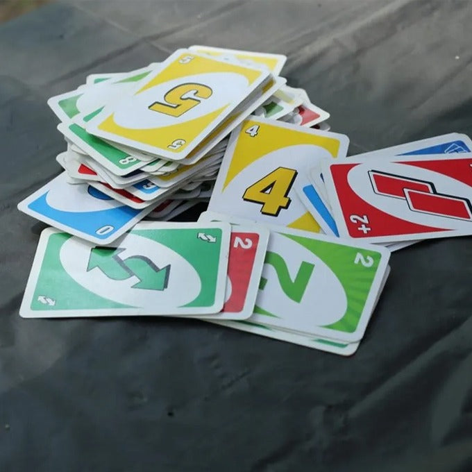 UNO cards spread out showing reverse skip draw 2 and wild cards in all 4 colors