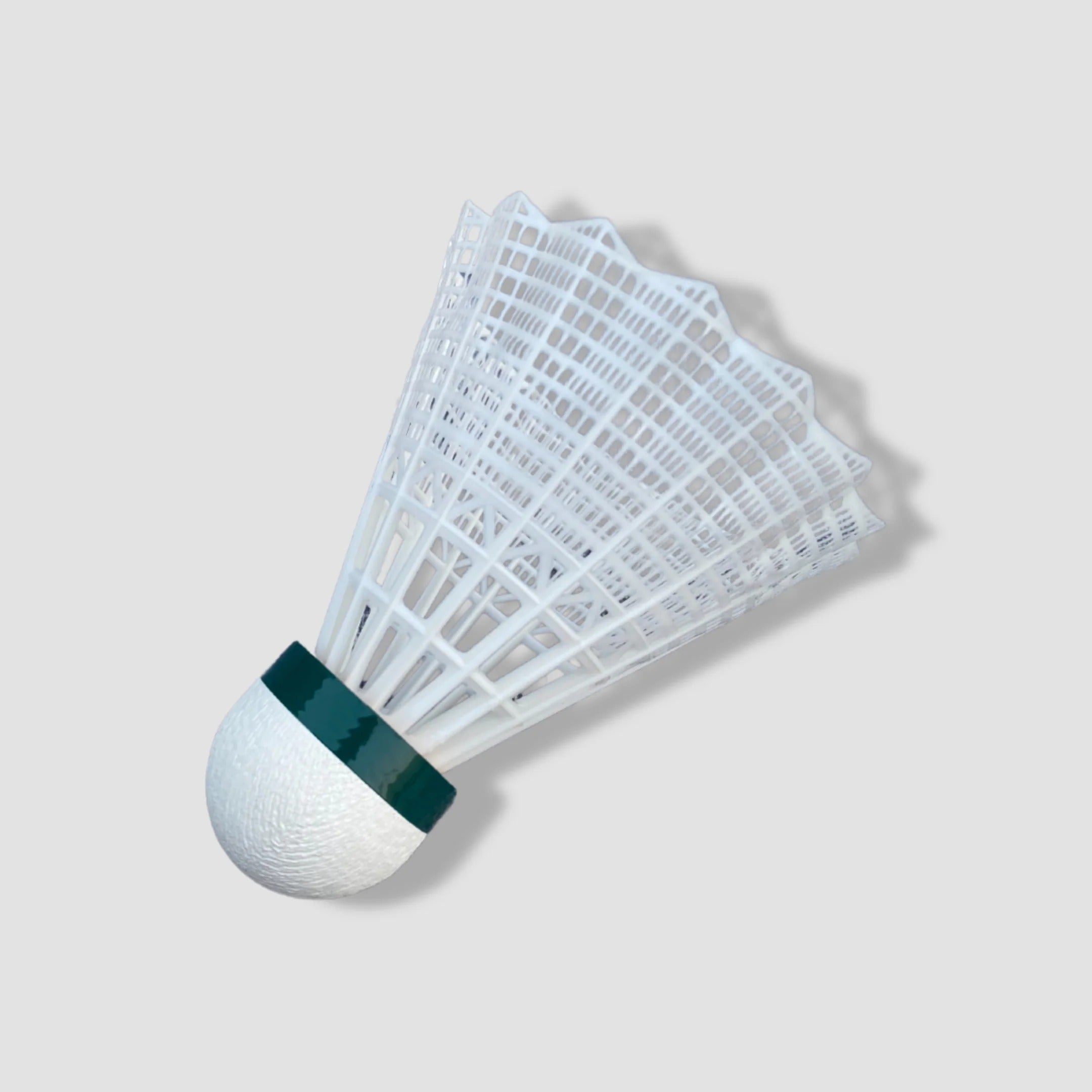 GoldStar Heat X nylon badminton shuttlecock white single piece close-up showing nylon skirt and cork base